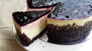 Superb cottage cake with dark base and glossy berry topping